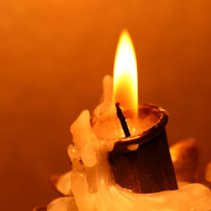 Warmth of candle flame - self care during the holidays